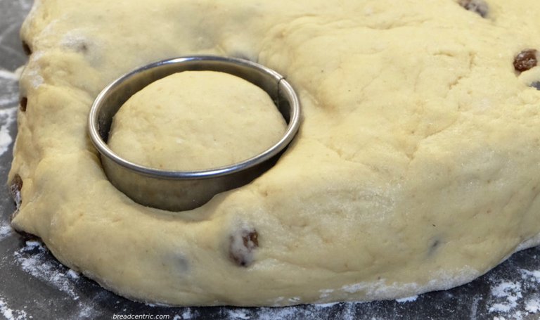 The cutter sinks in the dough