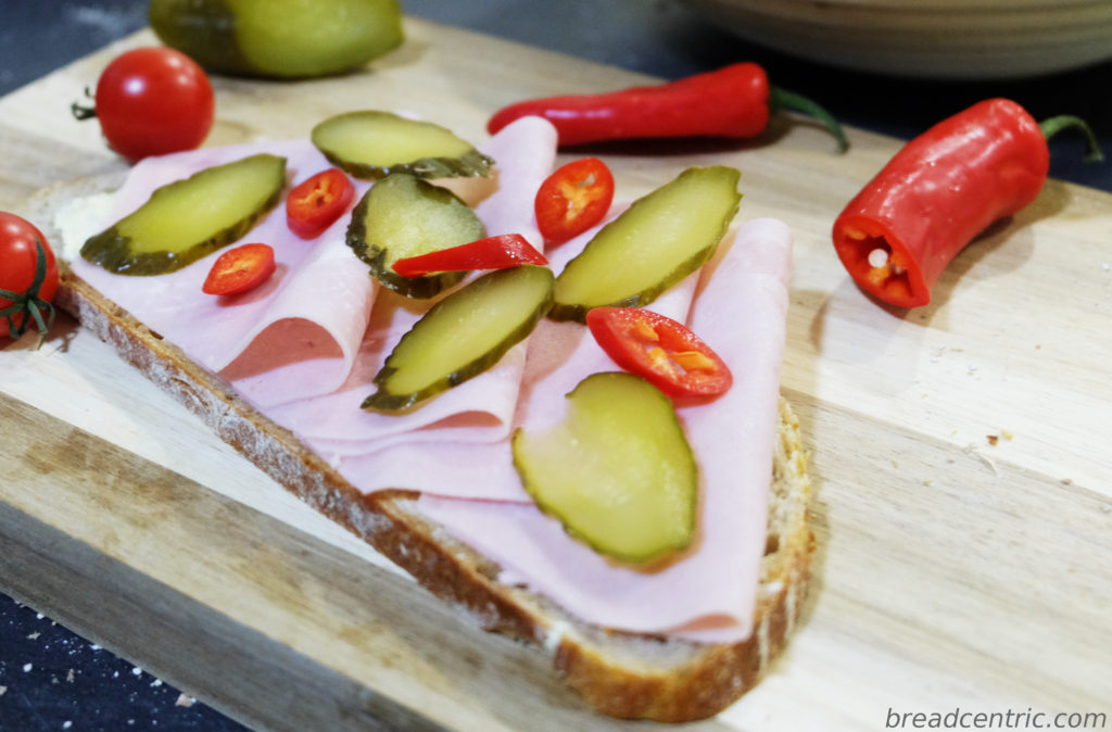 Silesian sourdough sandwich with ham, cucumber and chili