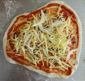 Pizza with tomato sauce, anchovies, cheese and onion